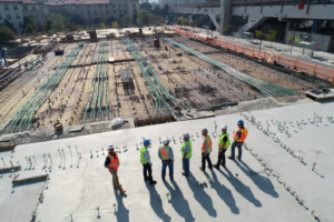 A team of construction workers standing and talking.