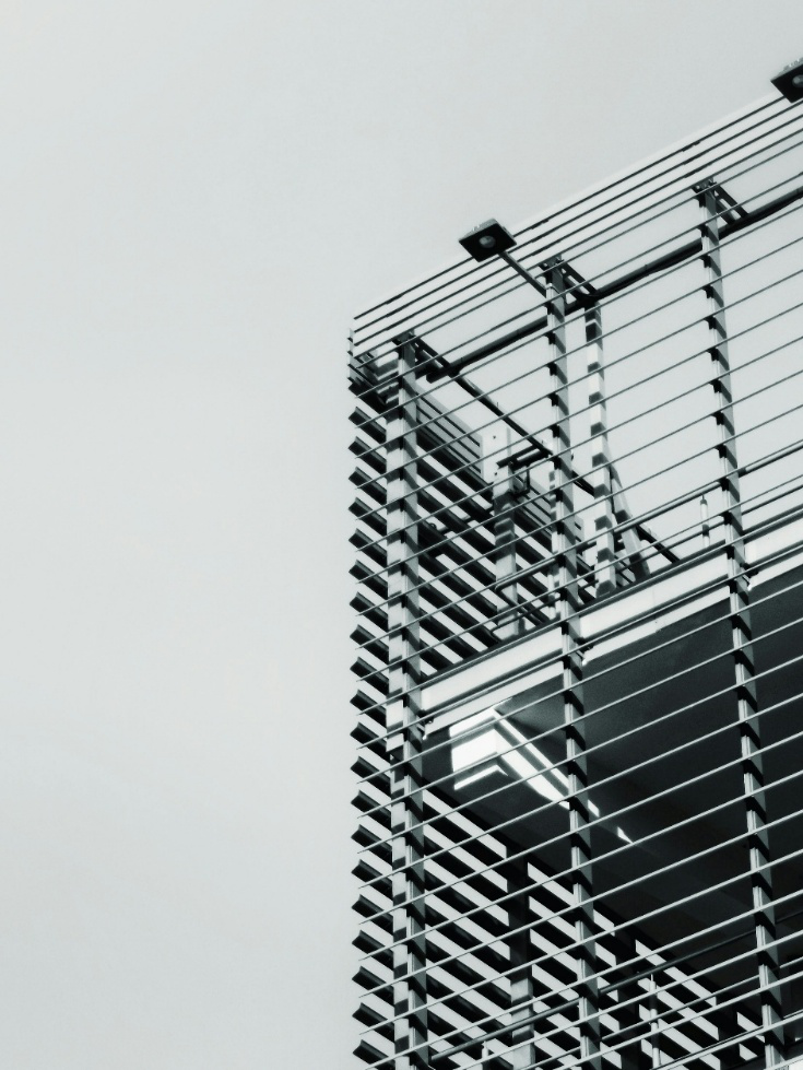 Close-up of steel framework with horizontal lines and structural detailing on a modern building