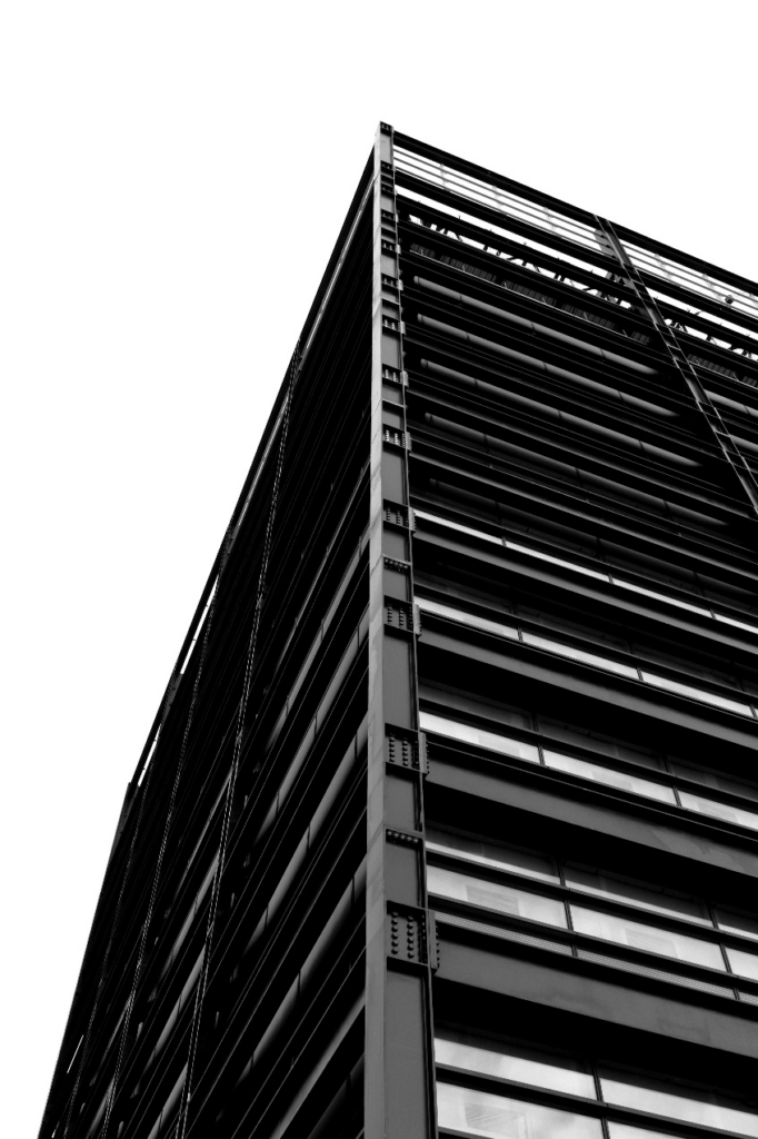 Modern commercial steel building with exposed framework and linear architectural design