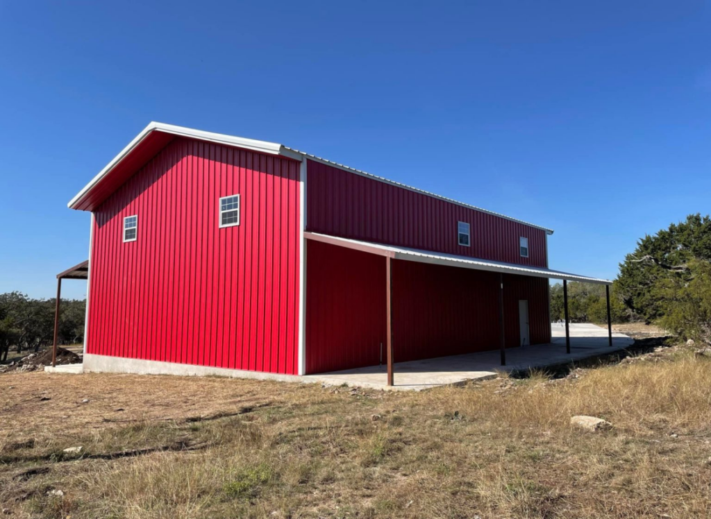 A metal building with red walls 