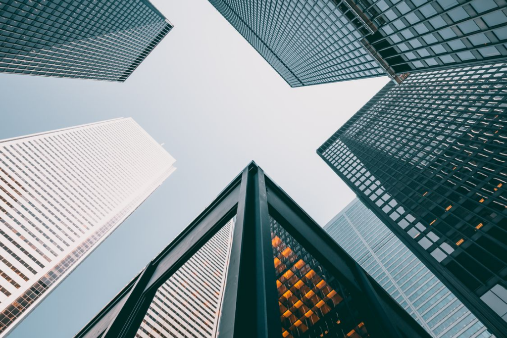 Several buildings towering over a space.