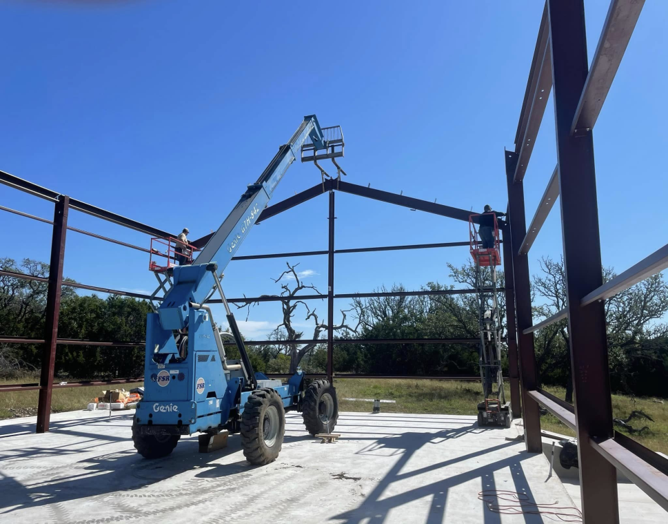A vehicle working on a metal framework 