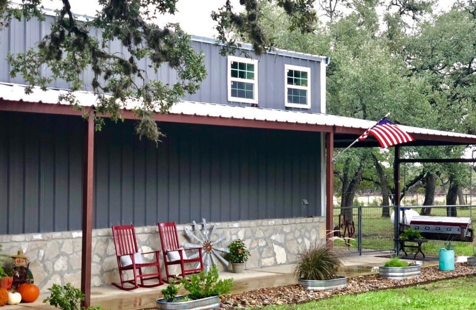 A metal building with a yard