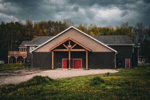 view of a barndominium under stormy weather