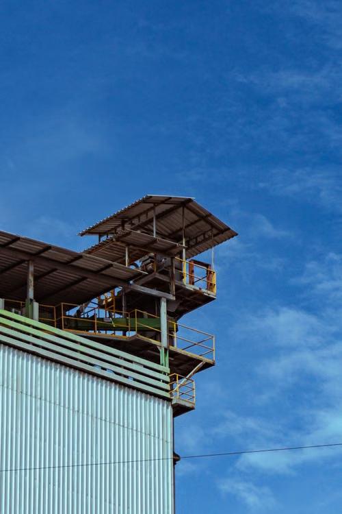A large metal building with stairs.