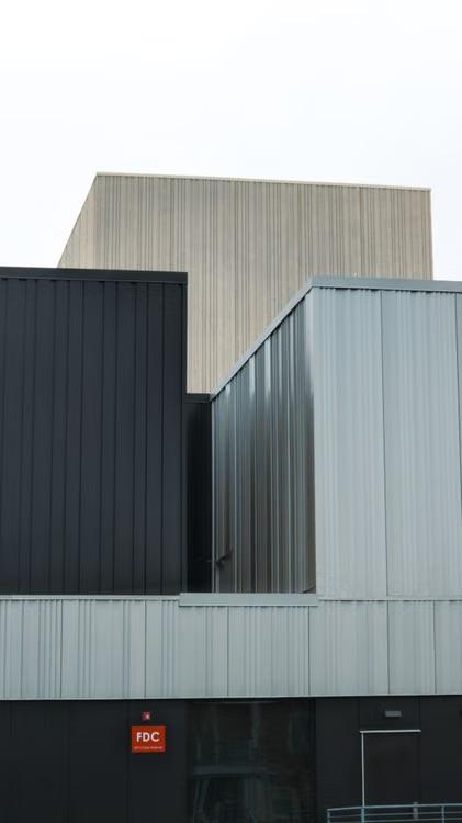 A large number of metal buildings together.